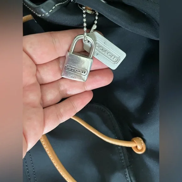 COACH canvas backpack and COACH leather wallet.